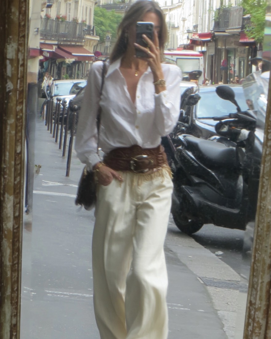 White shirt, satin trousers and a wide leather belt in a Paris street mirror selfie