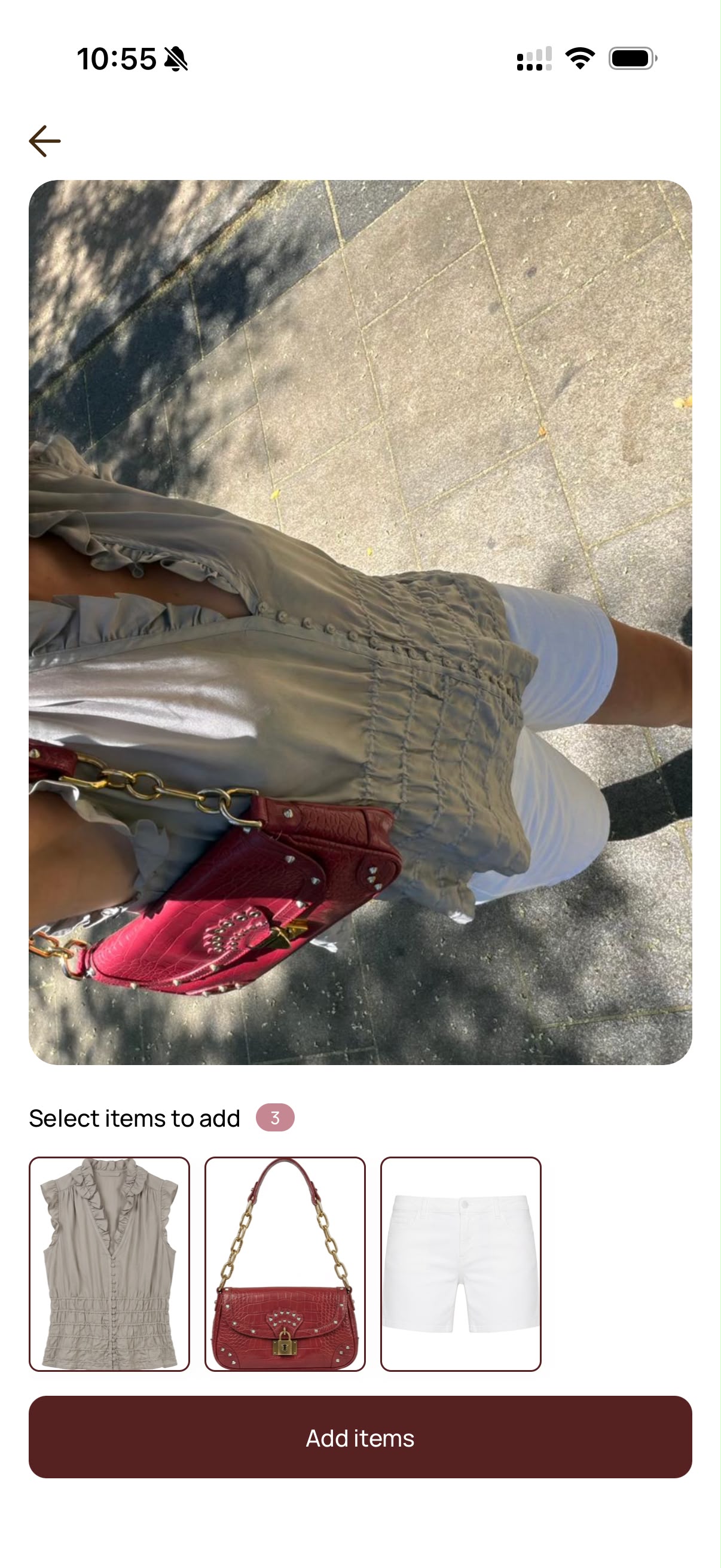 A fit check in Portal: a photo of the outfit as it was worn, and underneath it the three pieces Portal read out of the photo — a ruffled sage blouse, a red croc shoulder bag and white denim shorts — ready to be added to the closet.